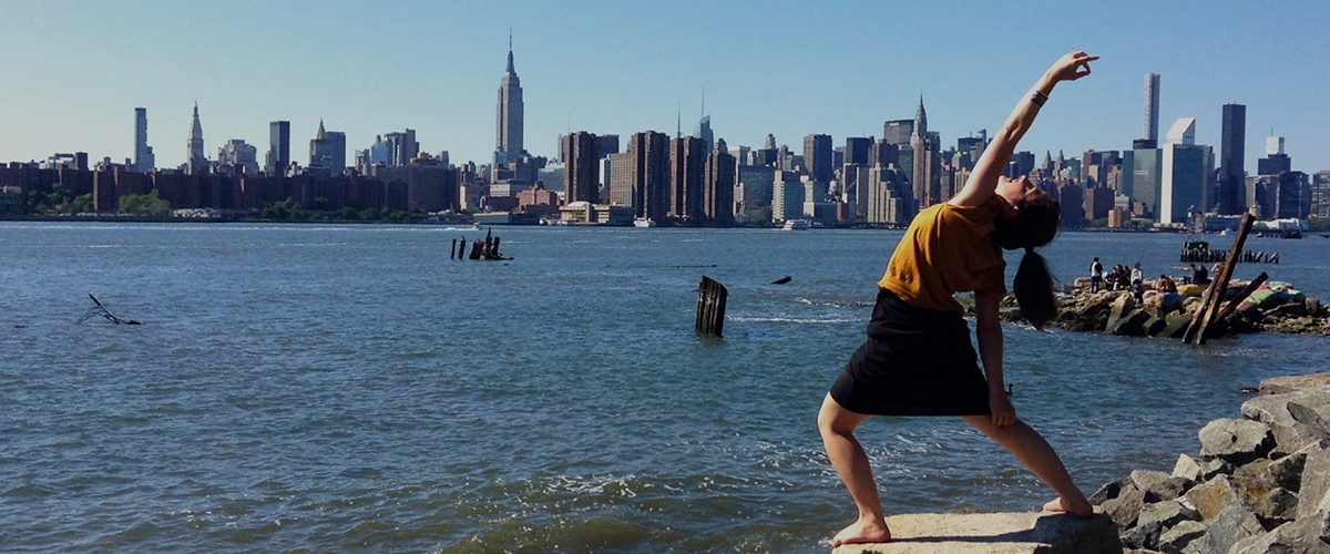 Peaceful Warrior Pose against the New York Skyline
