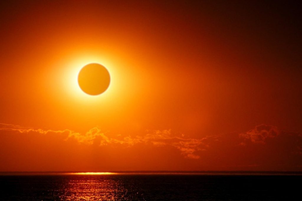 Solar eclipse over water